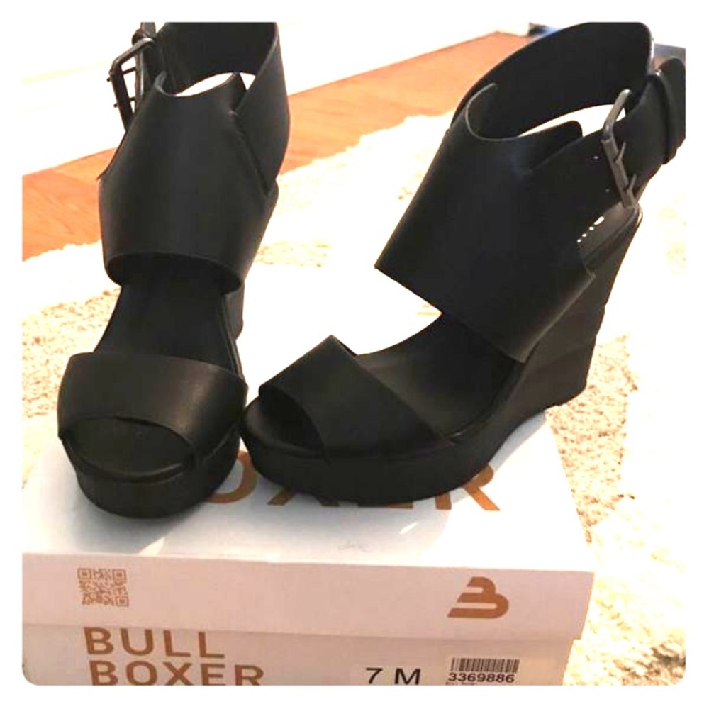 Black size 7, never worn bull boxer heels
